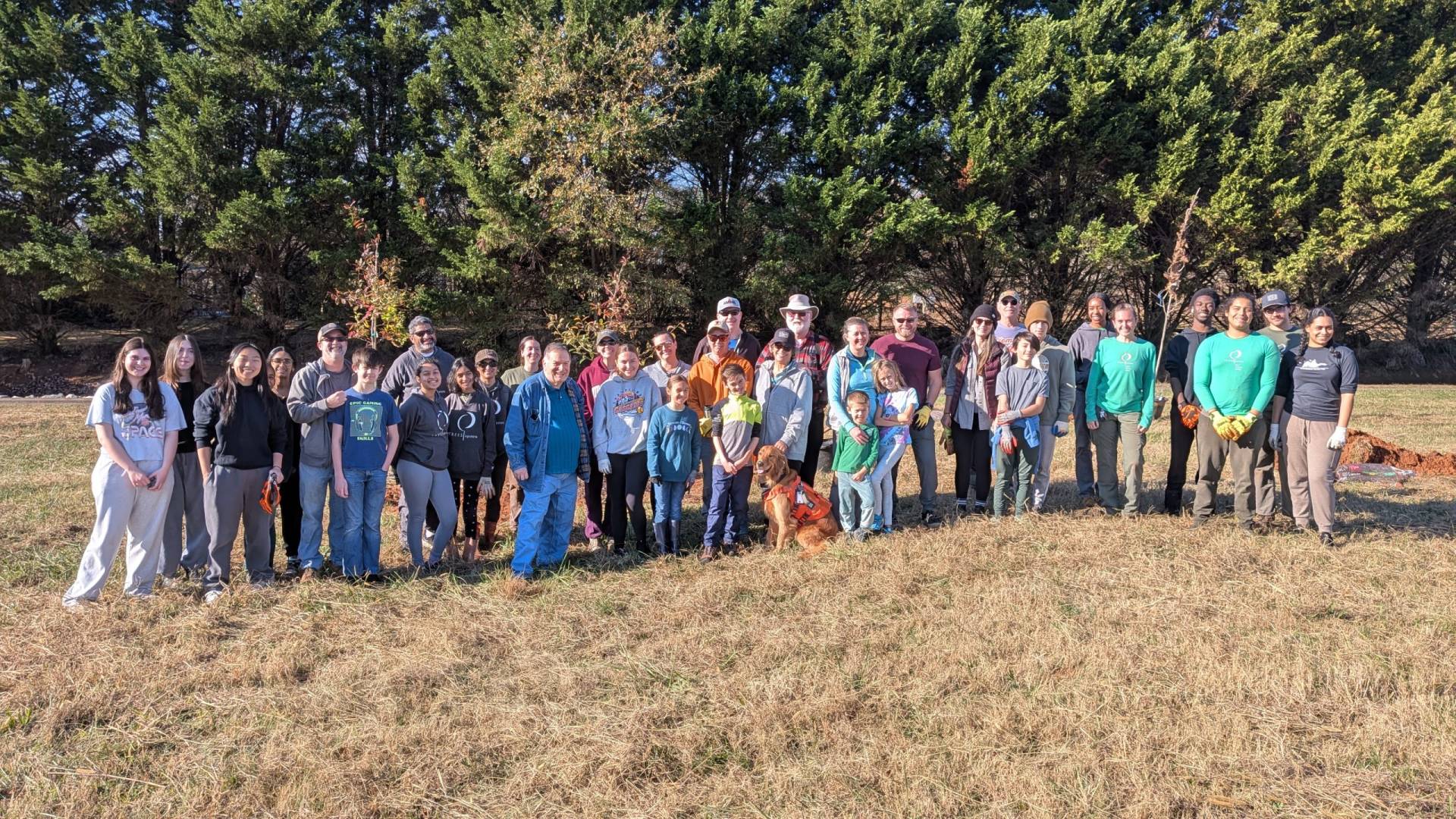 All of the volunteers posing at the Bryson site before planting trees